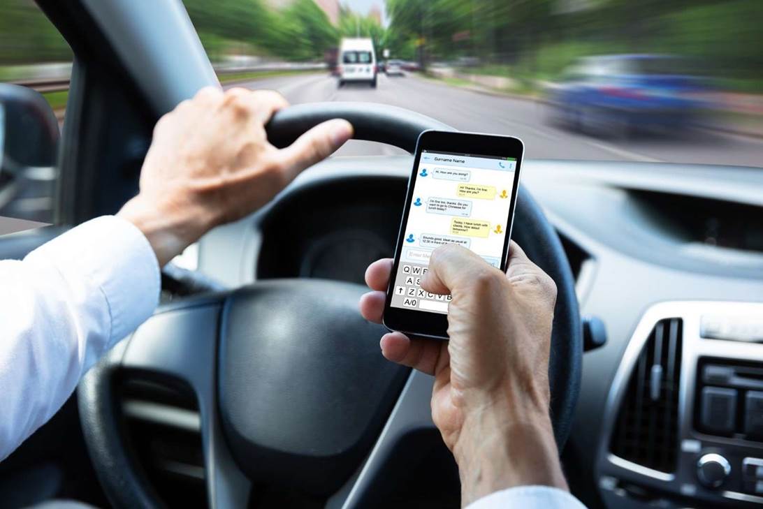 A person using a phone while driving

AI-generated content may be incorrect.